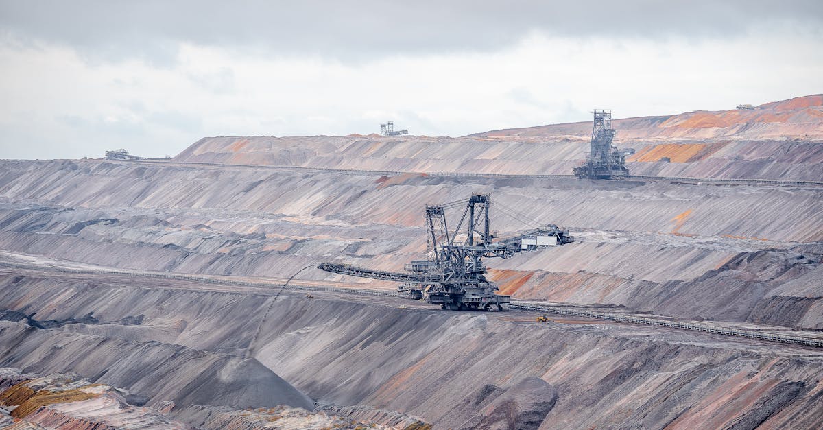 Aerial view of bucket-wheel excavators in an expansive open-pit coal mine.